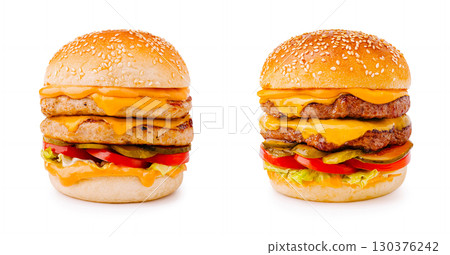 Delicious stacked burgers with cheese and fresh toppings ready to enjoy 130376242