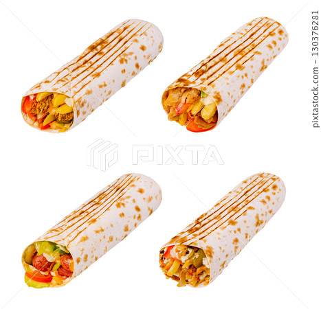 Savory wraps with fresh veggies and grilled meats on white 130376281