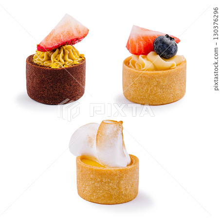 Delicious small desserts arranged elegantly on a white background Delicious small desserts arranged elegantly on a white background 130376296