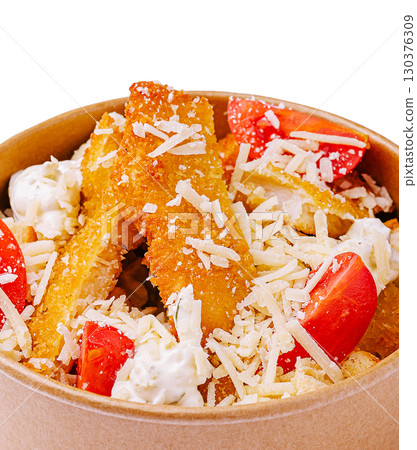 Delicious vegetarian snack with crispy fries and fresh toppings at local eatery 130376309