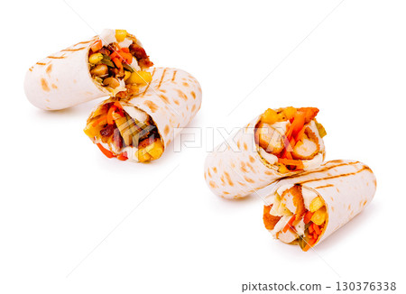 Grilled chicken wraps with fresh veggies on a white background Grilled chicken wraps with fresh veggies on a white background 130376338