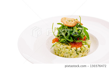 Delicate vegetable tartare featuring fresh greens and garnishes Delicate vegetable tartare featuring fresh greens and garnishes 130376472