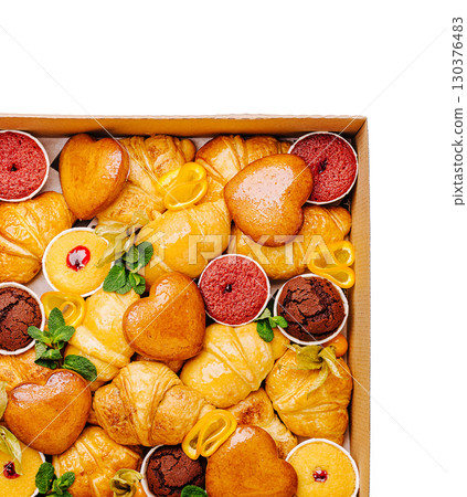 Delicious assortment of pastries in a box ready for celebration 130376483