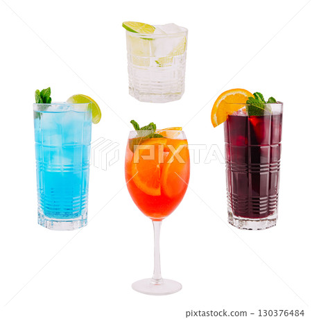 Colorful cocktails served on a white background with garnishes 130376484
