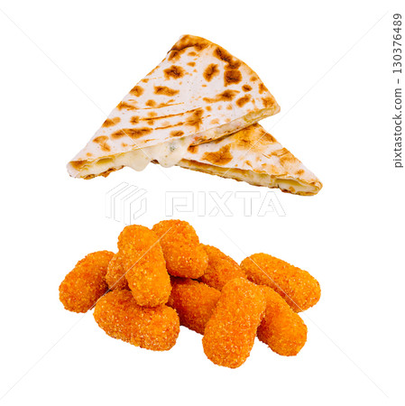 Delicious quesadilla and golden cheese bites served as a snack platter 130376489