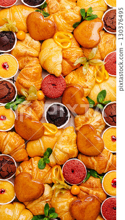 Selection of assorted pastries and desserts arranged beautifully on a platter 130376495