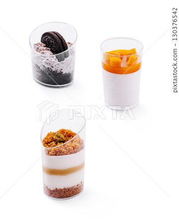 Delicious dessert cups featuring layered flavors and textures 130376542