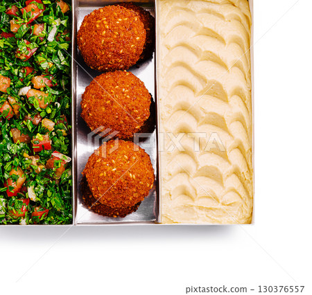 Traditional Middle Eastern platter with falafel, hummus, and tabbouleh salad 130376557