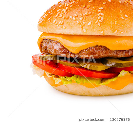 Delicious cheeseburger with fresh toppings on sesame seed bun 130376576