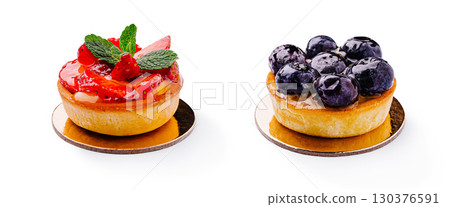 Delicious fruit tarts with strawberries and blueberries on display 130376591