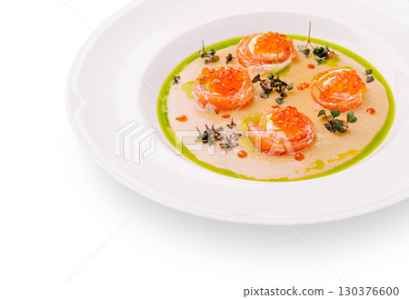 Salmon appetizers presented on a stylish white plate with vibrant garnishes Salmon appetizers presented on a stylish white plate with vibrant garnishes 130376600