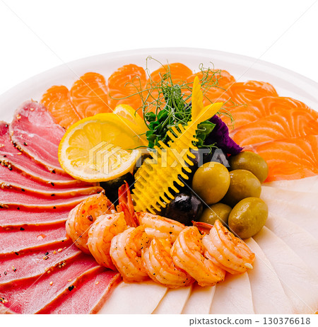 Fresh seafood platter featuring shrimp, salmon, and tuna with garnish Fresh seafood platter featuring shrimp, salmon, and tuna with garnish 130376618