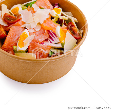 Healthy salad bowl with salmon, cherry tomatoes, and Parmesan cheese 130376639