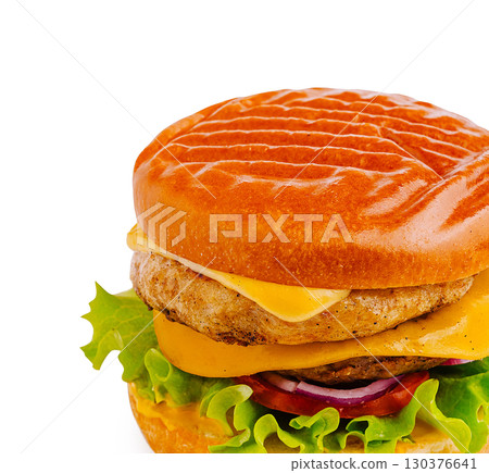 Delicious burger with melted cheese and fresh vegetables ready to be enjoyed 130376641