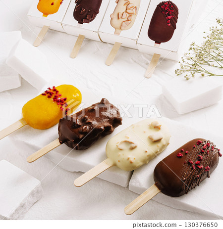Assorted frozen desserts displayed on a white background in a kitchen setting 130376650