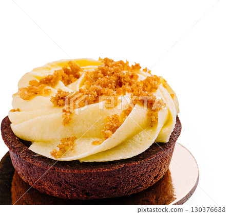 Delicious chocolate cupcake topped with creamy frosting and crumbs Delicious chocolate cupcake topped with creamy frosting and crumbs 130376688