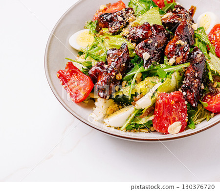 Tasty grilled chicken salad with fresh veggies, perfect for lunc Tasty grilled chicken salad with fresh veggies, perfect for lunc 130376720