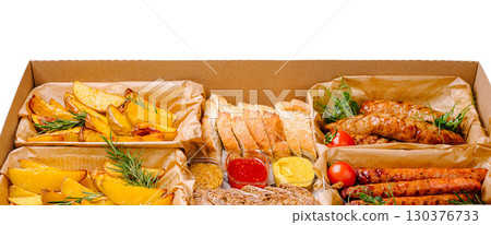 Gourmet platter featuring assorted meats, sauces, and fresh sides for gatherings Gourmet platter featuring assorted meats, sauces, and fresh sides for gatherings 130376733