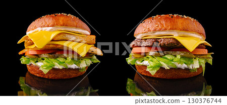 Delicious double cheeseburger and loaded fries sandwich on black background Delicious double cheeseburger and loaded fries sandwich on black background 130376744