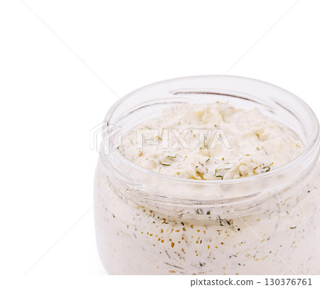 Creamy herb dip in a glass jar with fresh ingredients Creamy herb dip in a glass jar with fresh ingredients 130376761