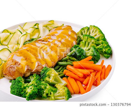 Healthy meal featuring grilled chicken breast with vegetables on a white plate Healthy meal featuring grilled chicken breast with vegetables on a white plate 130376794