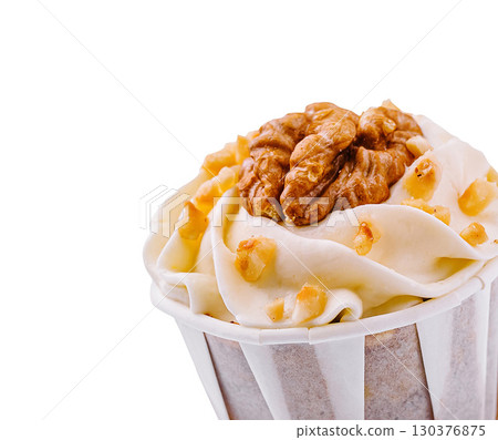 Delicious cupcake topped with a walnut, perfect for any dessert Delicious cupcake topped with a walnut, perfect for any dessert 130376875