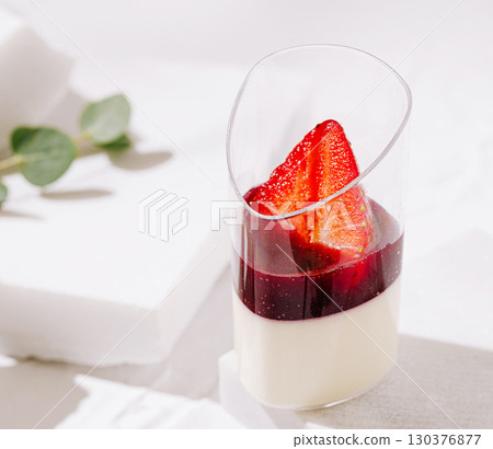 Delightful layered dessert featuring strawberries and berry sauce Delightful layered dessert featuring strawberries and berry sauce 130376877
