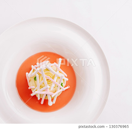 Tasty dessert with vibrant sauce and delicate toppings in fine dining Tasty dessert with vibrant sauce and delicate toppings in fine dining 130376965