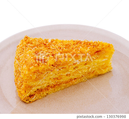 Delicious slice of cake served on a simple plate in natural ligh Delicious slice of cake served on a simple plate in natural ligh 130376998