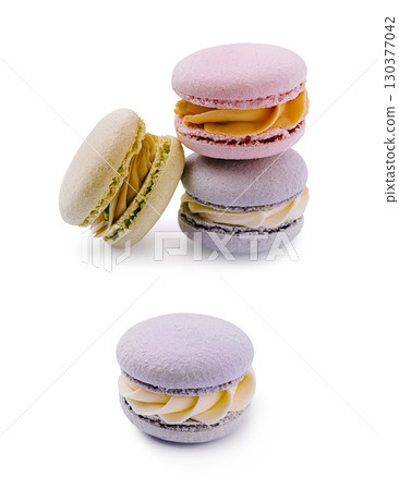 Delicious macarons in pastel colors arranged neatly on a white background Delicious macarons in pastel colors arranged neatly on a white background 130377042