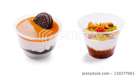 Creamy layered dessert cup topped with a cookie for indulgence Creamy layered dessert cup topped with a cookie for indulgence 130377061