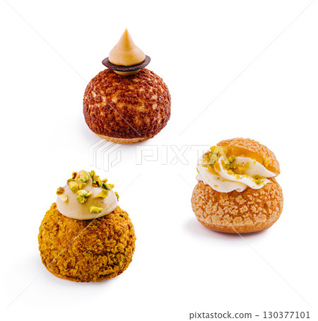 Tempting pastries artfully arranged on a clean white backdrop 130377101