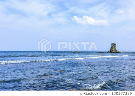 The female rock formations of Toyama Bay seen from Amaharashi Coast in Takaoka City 130377359