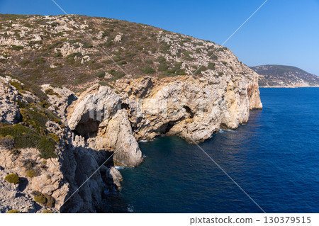 A rugged coastline of Patara beach, Turkey featuring natural cliffs and sea waters A rugged coastline of Patara beach, Turkey featuring natural cliffs and sea waters 130379515