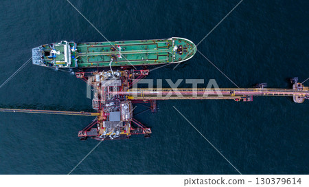 Aerial view crude oil tanker ship at sea, Crude oil tanker ship top view, Logistic and maritime transpoprtation of petroleum, Modern offshore terminal loading tanker ship. Aerial view crude oil tanker ship at sea, Crude oil tanker ship top view, Logistic and maritime transpoprtation of petroleum, Modern offshore terminal loading tanker ship. 130379614