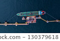Aerial view crude oil tanker ship at sea, Crude oil tanker ship top view, Logistic and maritime transpoprtation of petroleum, Modern offshore terminal  loading tanker ship. 130379618