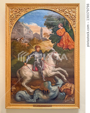 VATICAN CITY, ROME, ITALY - AUGUST 02, 2025 Oil painting by Paris Bordone, depicts the dramatic legend of Saint George and the Dragon. A knight in armor on a white horse slaying a fearsome beast 130379798