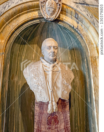 VATICAN CITY, ROME, ITALY - AUGUST 02, 2025 detailed white marble bust of Pope Pius XI, wearing intricate robes with detailed carvings of floral and leaf patterns 130379803