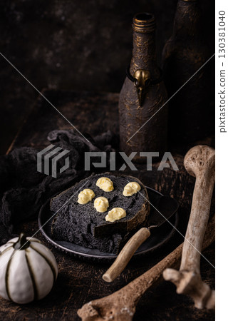 Halloween toast with butter in shape of skull Halloween toast with butter in shape of skull 130381040