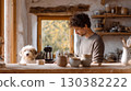 Man with curly hair is crafting pottery in a rustic workshop, with a friendly dog nearby, showcasing a serene creative environment 130382222