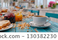 Morning breakfast scene featuring coffee, bread, and colorful jams on a rustic blue table, creating a cozy and inviting atmosphere for dining 130382230