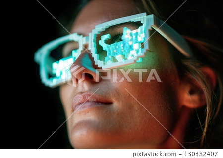 Experiencing virtual reality through neon glasses in a darkened environment 130382407