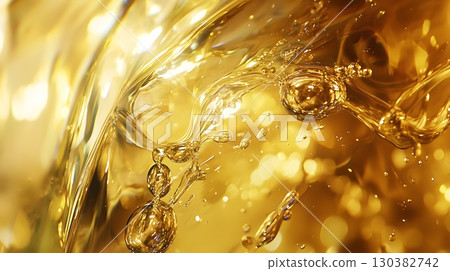 A splash of liquid with bubbles floating in the air A splash of liquid with bubbles floating in the air 130382742