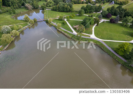 Aerial drone view over tranquil Boating lake in Nagykanizsa, Hungary. Aerial drone view over tranquil Boating lake in Nagykanizsa, Hungary. 130383406