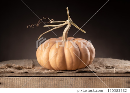 Muscade De Provence Pumpkin On Wooden Box With Burlap 130383582