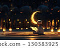 Little Muslim boy reads the Quran under the moon and stars. 130383925