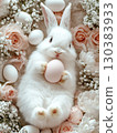 Easter Bunny with a pink egg on among flowers on pink background. 130383933