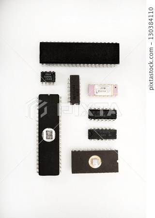 Several different chips on a white background. Old electronic chips. 130384110