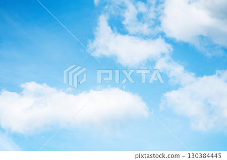 Bright blue sky with white clouds and sunlight Bright blue sky with white clouds and sunlight 130384445