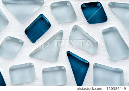 Transparent blue ice-like geometric shapes in abstract mosaic composition 130384449